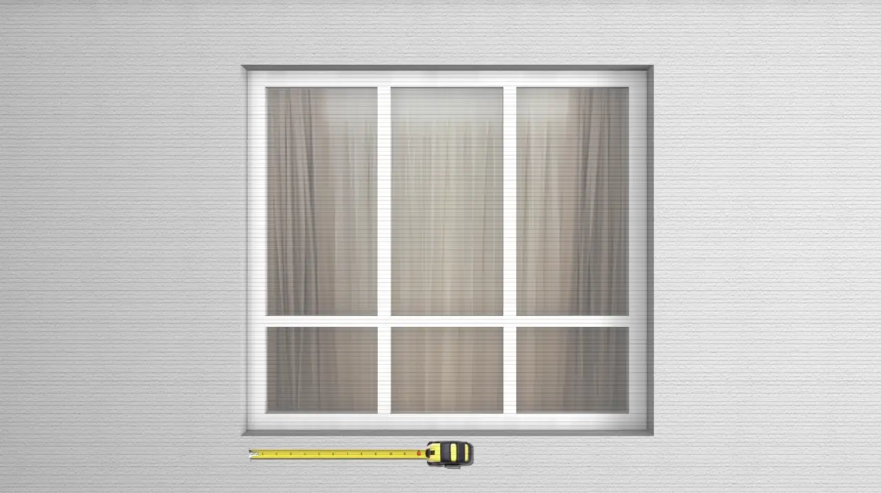 Measuring a window opening with a tape measure for security bar installation