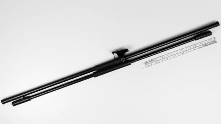 Flat lay product photograph of matte black telescopic egress-compliant window security bar with quick-release mechanism